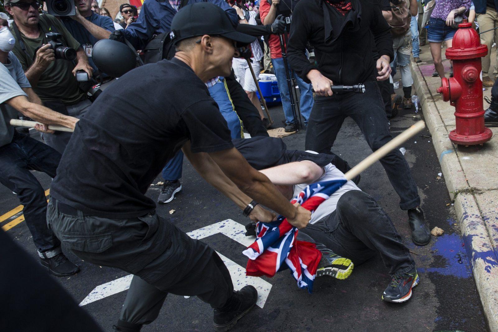 Vasillios Pistolis, a U.S. Marine, clubs a man with a wooden flagpole during the deadly white supremacist rally in Charlottesville