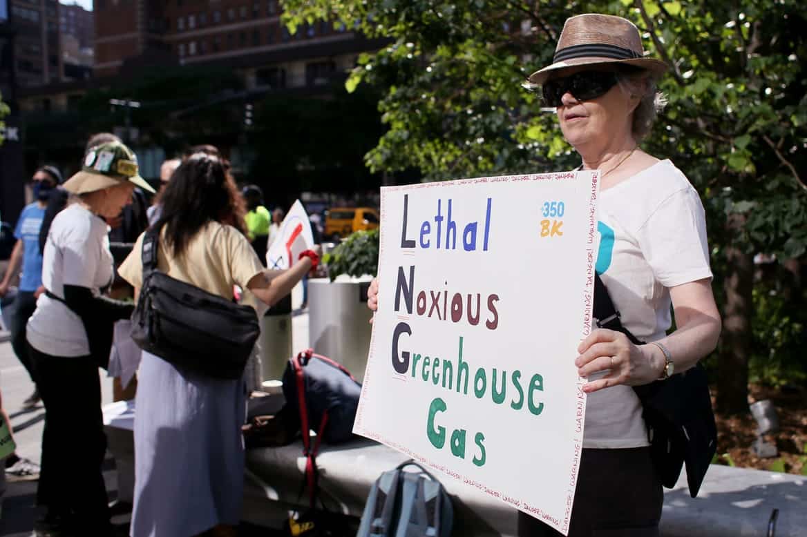 A climate activist protests LNG