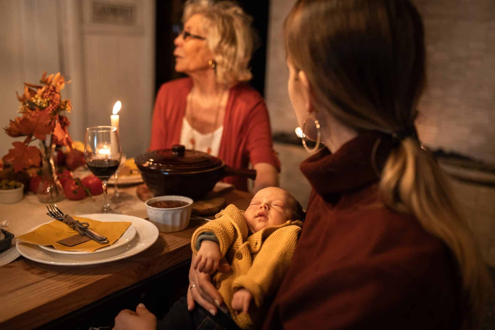 woman in red long sleeve shirt sitting beside woman in yellow long sleeve shirt