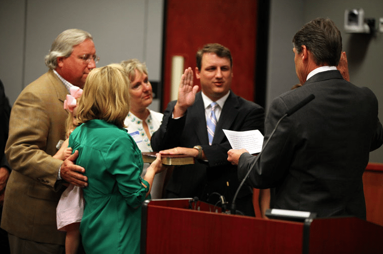 Perry swearing in Bech Bruun to the Texas Water Development Board.