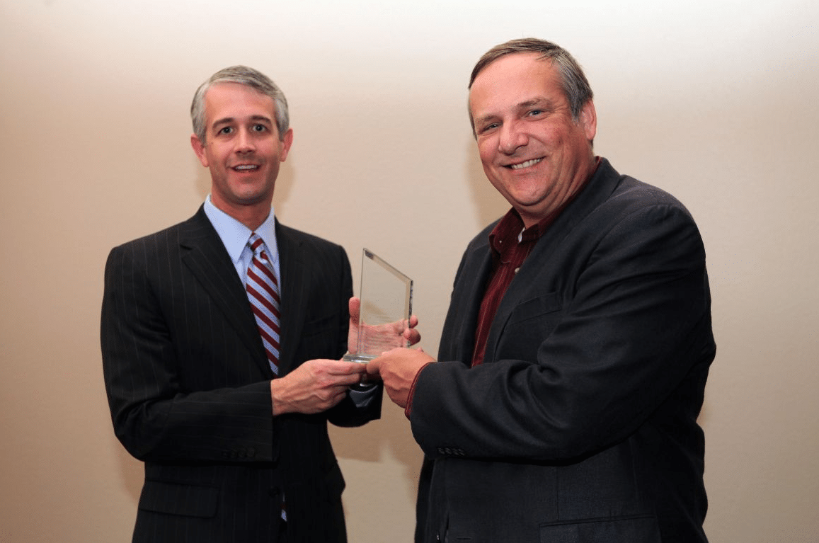 Texas A&M VP Jason Cook presents Newsmaker Image Award to Professor John Nielsen-Gammon. Image courtesy of Texas A&M.