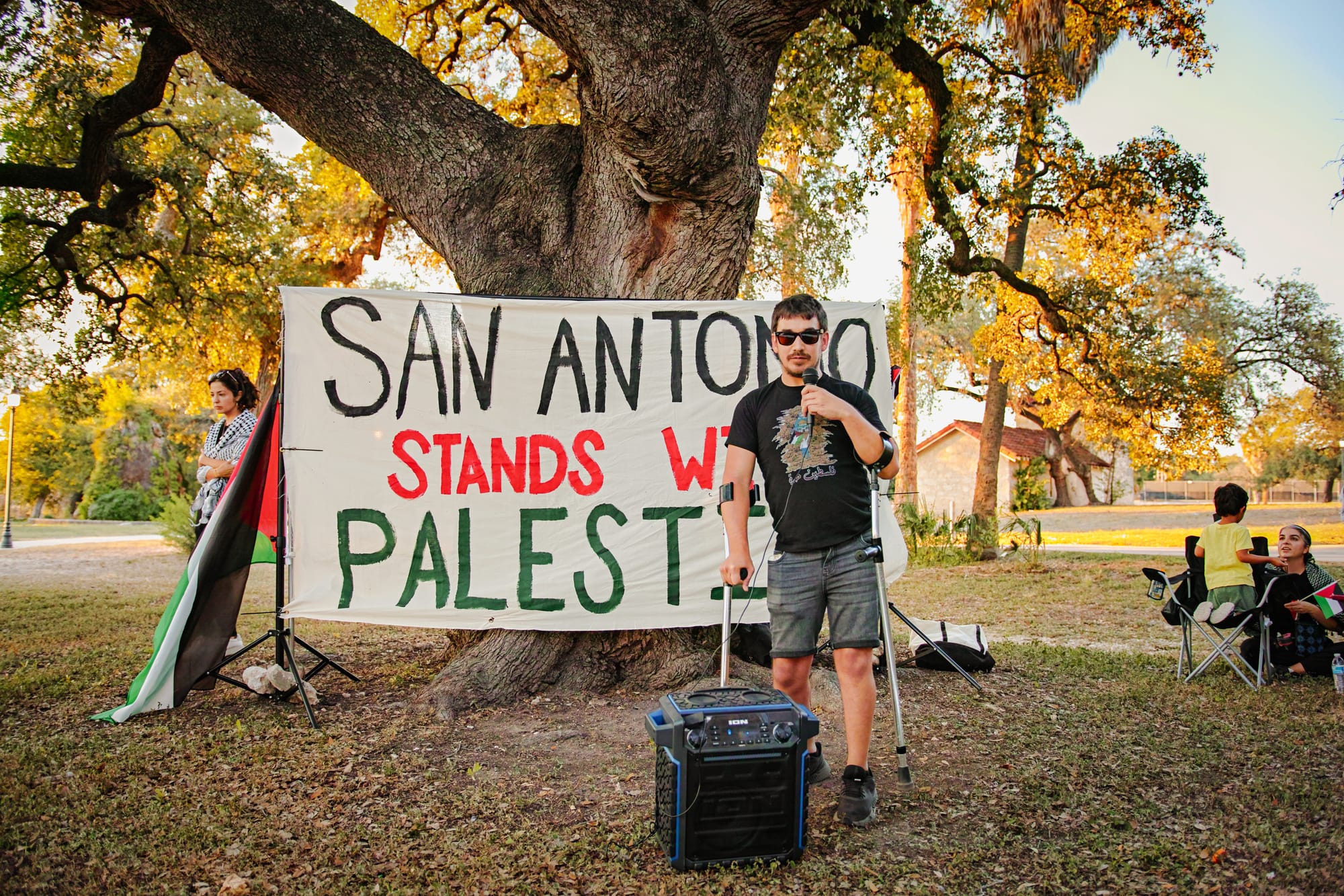 Palestine banner w/ Alex Birnel at San Pedro Springs Park 