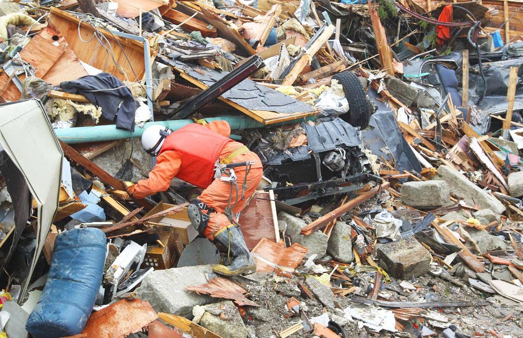 Rescue teams searching for missing people in Natori, Japan, 2011. Image: Iliya Pitalev